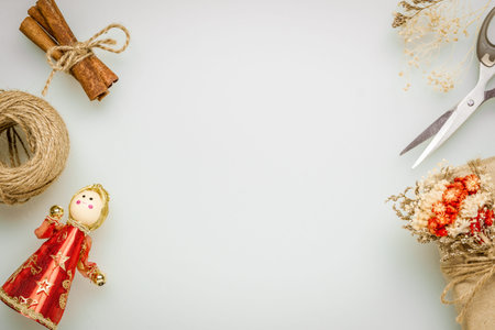 Hand crafted DIY gift box and Christmas ornaments desktop scene. Natural present boxes for Christmas, New year or other anniversary. Greeting card with copy space.の写真素材