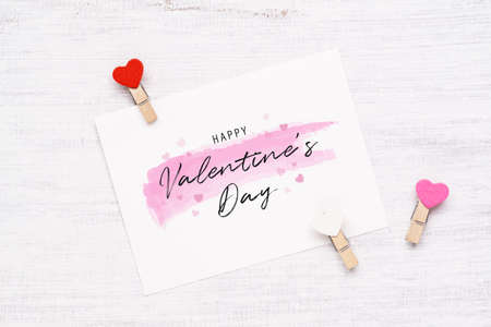 Mockup postcard and envelope on wood background for Happy valentines day. Flat lay top view valentine's day background concept.の写真素材