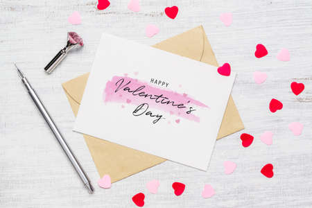 Mockup postcard and envelope on wood background for Happy valentines day. Flat lay top view valentine's day background concept.の写真素材