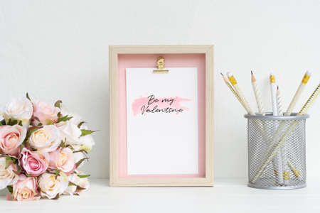 Mockup Picture frame and pink roses. Valentines Day Background concept with copy space. Mock up with photo frame and flowers with space for your picture or textの写真素材