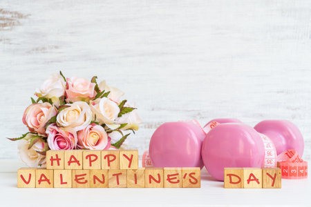 Happy Valentine's day for fitness healthy active lifestyle background concept with pink dumbbells...
