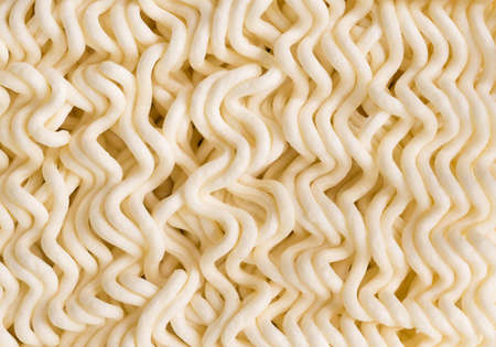 Top view close up of instant noodles texture background. Selective focus. tasty dry fastfood traditional asian meal.の写真素材