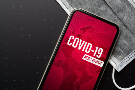 Coronavirus or Covid-19 outbreak News Update background concept. Mockup mobile phone Coronavirus...