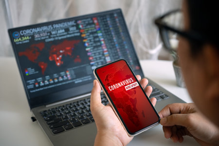 Coronavirus or Covid-19 pandemic  News Update background concept. Mockup mobile phone, a person...
