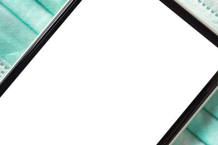 Mock up Blank white screen mobile phone on light blue facial masks.の写真素材