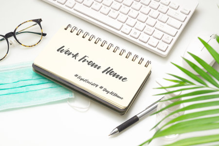 Mock up Notebook with keyboard on white working desk.の写真素材