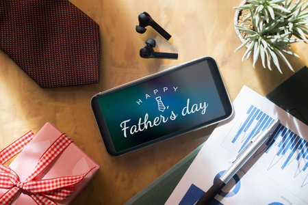 Father's day background concept. Mock up mobile phone with Happy Father's day message and...