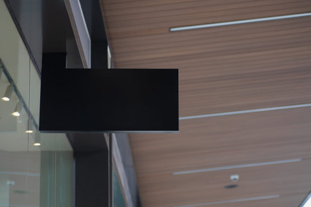 Blank black mockup of modern store signboard with modern architecture and glass windows.  Mock up...