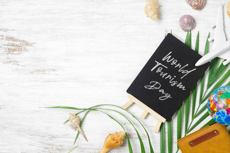 World tourism day background concept flat lay with copy space. World Tourism Day typography on black...