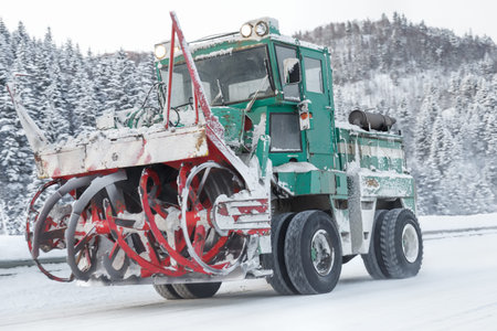 machine cleans snow from the roadの写真素材