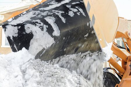 machine cleans snow from the roadの写真素材