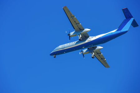 wide-body aircraft is flying, blue sky, turbine, propeller, screw, take off wingsの写真素材