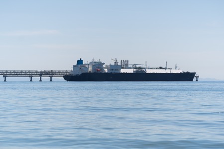 GAS CARRIER IN PORT - Ship at the harbor at dawnの写真素材
