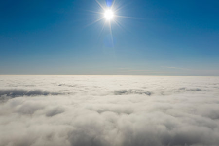 Rare early morning winter fog over the city skyline of the sea bay and skyscrapers before sunrise.の写真素材
