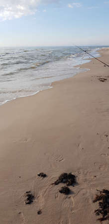 Fishing rods in the Baltic Sea beachの写真素材