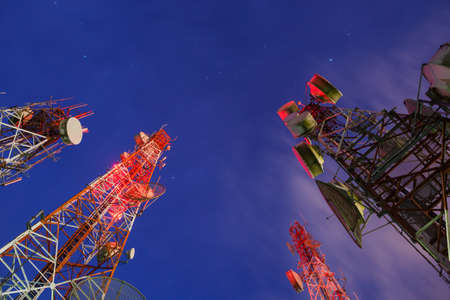 Group of Telecommunication towers at nightの写真素材