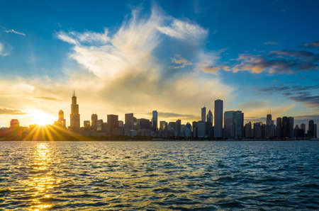 Chicago city downtown urban skyline at dusk with skyscrapers over Lake Michiganの写真素材