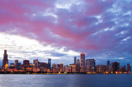 Chicago city downtown urban skyline at dusk with skyscrapers over Lake Michiganの写真素材