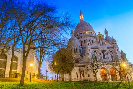 Sacred Heart Cathedral over the hill of Montmartre in Paris の写真素材