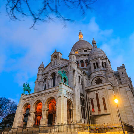 Sacred Heart Cathedral over the hill of Montmartre in Paris の写真素材