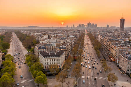 The famous Champs-Elysées in Paris from the top of the Arc De Triomphe at night の写真素材