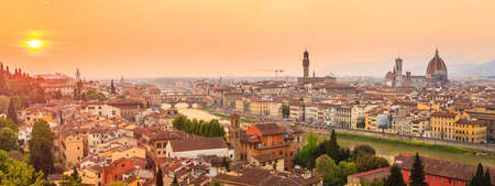 Florence city during sunset. Panoramic view to the river Arno, with Ponte Vecchio, Palazzo Vecchio and Cathedral of Santa Maria del Fiore (Duomo), Florence, Italyの写真素材