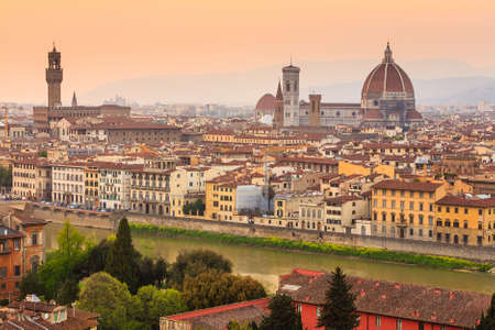 Florence city during sunset. Panoramic view to the river Arno, with Ponte Vecchio, Palazzo Vecchio and Cathedral of Santa Maria del Fiore (Duomo), Florence, Italyの写真素材