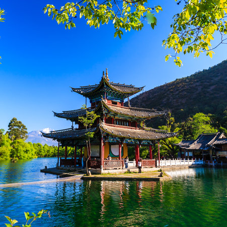 Lijiang old town scene-Black Dragon Pool Park. you can see Jade Dragon Snow Mountain in the background.のeditorial素材