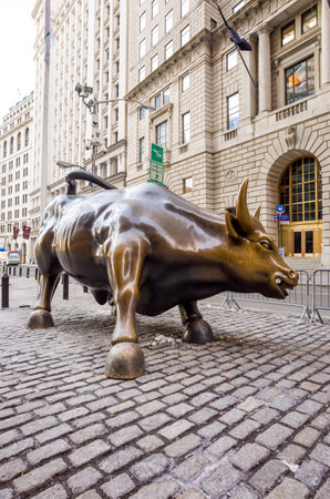 NEW YORK CITY - February 10, 2014: Charging Bull sculpture on February 10, 2014 in New York City. The sculpture is both a popular tourist destination and it is one of the most iconic images of New Yor.のeditorial素材