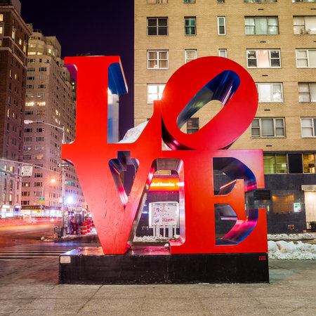 NEW YORK - February 10: Love sculpture at night on February 10, 2014 in New York. The famous monument by Robert Indiana is located on 6th Avenue.のeditorial素材