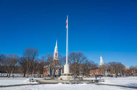 New Haven Green with snow and blue sky: a park in downtown New Haven, CT used for public events and bordered by Yale University.の写真素材
