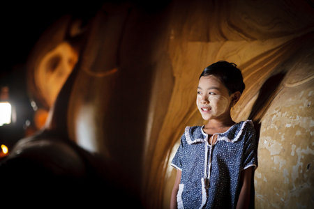 YANGON - MYANMAR - November 15, 2013: Unidentified Burmese girl with thanaka on her face on November 15, 2013 in Yangon, Myanmar. Thanaka is a yellowish-white cosmetic paste made from ground bark.

のeditorial素材