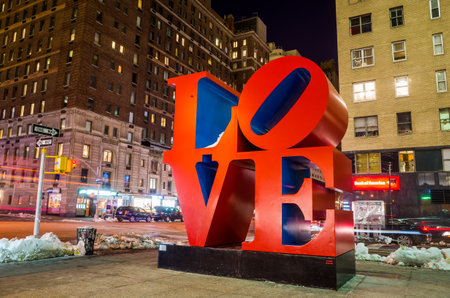 NEW YORK - February 10: Love sculpture at night on February 10, 2014 in New York. The famous monument by Robert Indiana is located on 6th Avenue.のeditorial素材