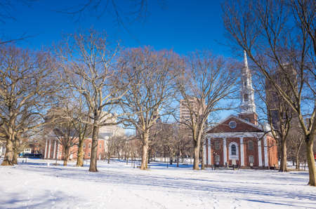 New Haven Green with snow and blue sky: a park in downtown New Haven, CT used for public events and bordered by Yale University.の写真素材