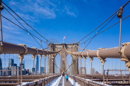 New York City Brooklyn Bridge in Manhattan with skyscrapers and city skyline over Hudson River.のeditorial素材