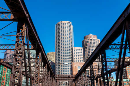 Boston waterfront with skyscrapers and bridge in the morningの写真素材