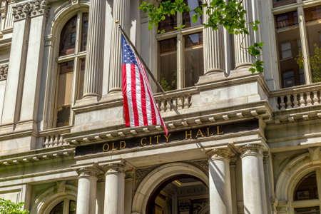 American flag on the Old City Hall building in Boston, Massachusetts, USAの写真素材