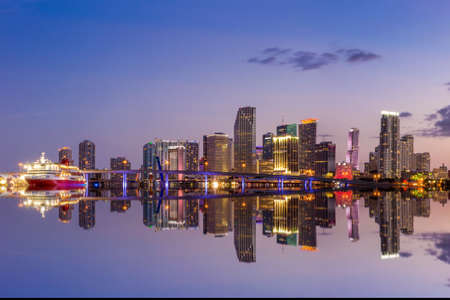 Miami city skyline panorama at twilight with urban skyscrapers and bridgeの写真素材