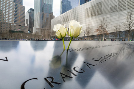 NEW YORK CITY - APRIL 10: NYC's 9/11 Memorial at World Trade Center Ground Zero seen on April 10, 2014. The memorial was dedicated on the 10th anniversary of the Sept. 11, 2001 attacks.のeditorial素材