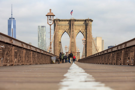 New York City Brooklyn Bridge in Manhattan with skyscrapers and city skyline over Hudson River.のeditorial素材