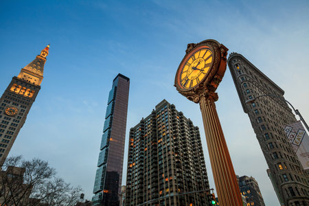 NEW YORK CITY, NY - AUG 3: Landmark Fifth Avenue cast iron sidewalk clock in Manhattan on Aug 2, 2013. This historic clock in the Flatiron District dates back to 1909.のeditorial素材