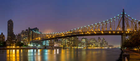 Queen Bridge and New York skylineの写真素材