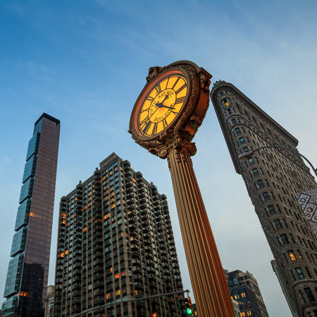 NEW YORK CITY, NY - AUG 3: Landmark Fifth Avenue cast iron sidewalk clock in Manhattan on Aug 2, 2013. This historic clock in the Flatiron District dates back to 1909.のeditorial素材