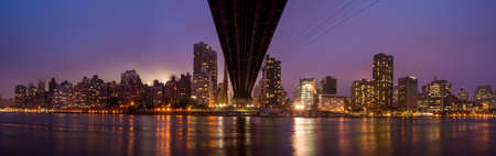Queen Bridge and New York skylineの写真素材