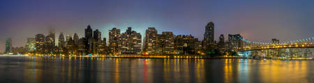 Queen Bridge and New York skylineの写真素材