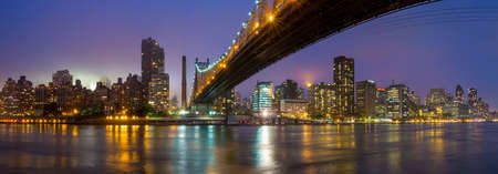 Queen Bridge and New York skylineの写真素材