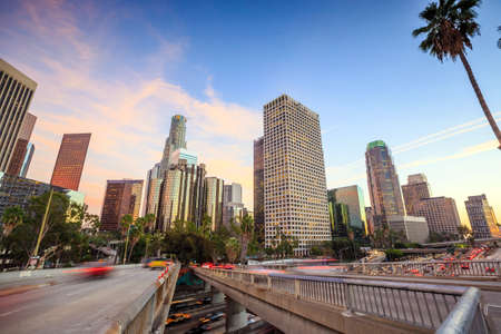 Downtown Los Angeles skyline during rush hour at sunsetの写真素材
