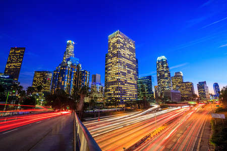 Downtown Los Angeles skyline during rush hour at sunsetの写真素材
