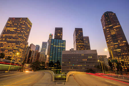 Downtown Los Angeles skyline during rush hour at sunset
