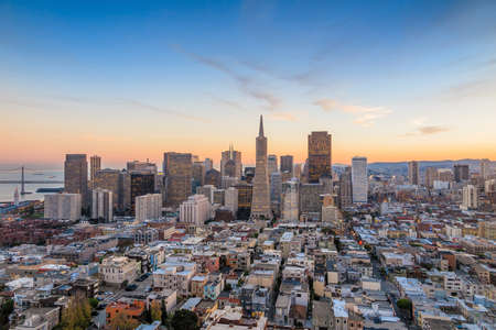 Beautiful view of  business center in downtown San Francisco at sunset.の写真素材